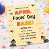 april fools day invitation card on colorful party table with confetti