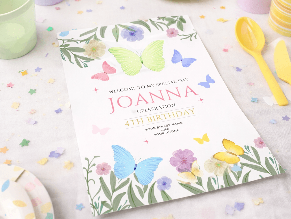 butterfly birthday invitation card with floral design on party table